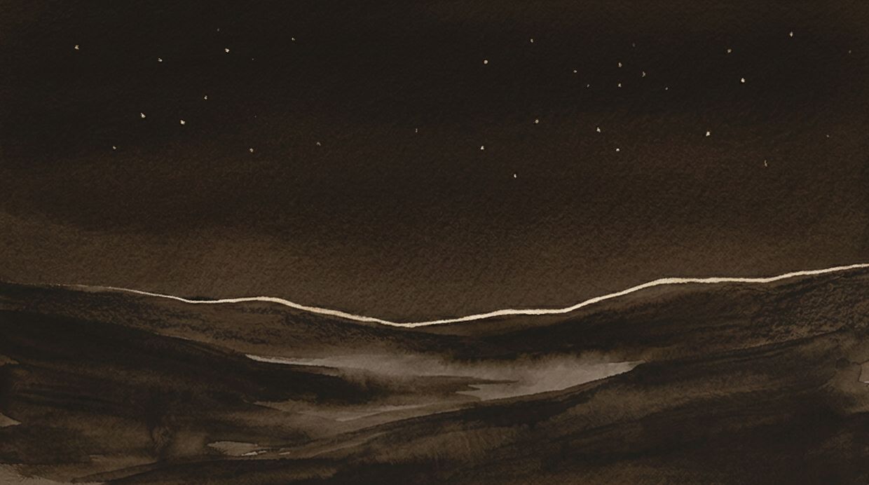 Photograph of a dark sleeping valley before dawn, a thin rim of light tracing the ridge