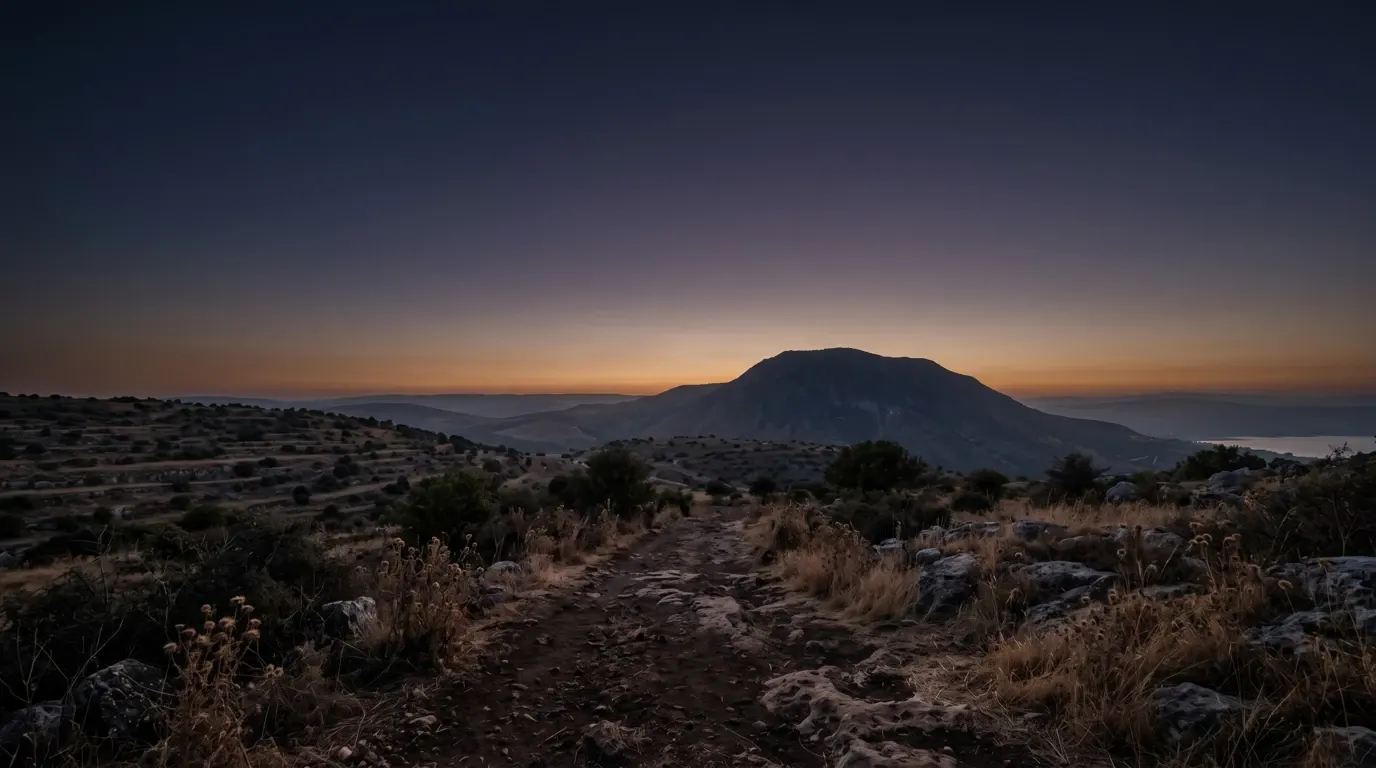A rounded mountain rising above the hills of Galilee.