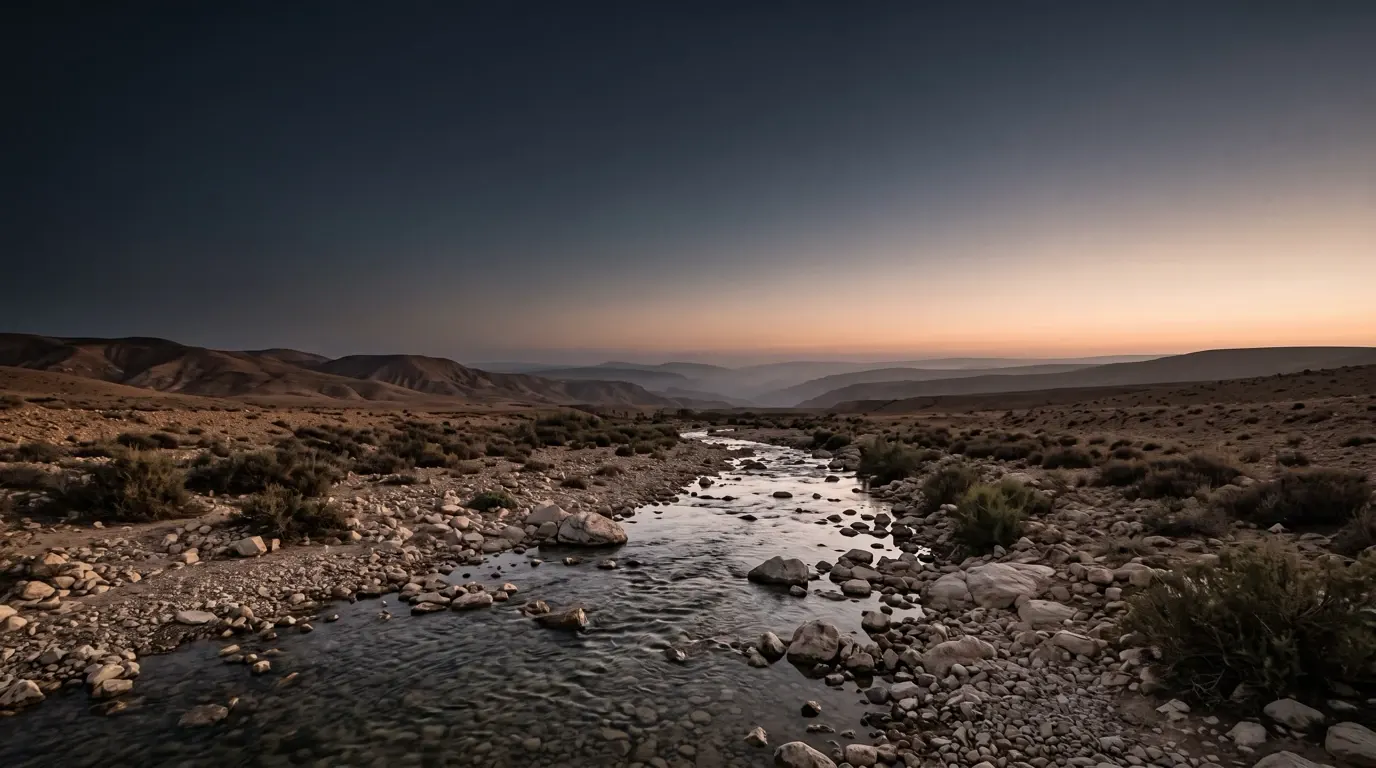Clear water running over the stones of a shallow river.